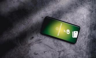 Top view of smartphone with the message of payment sent on screen. Concept of financial transactions with mobile devices. Closeup photo. Money sent transfer. Shopping online. photo