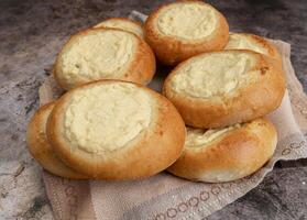 Vatrushka. ring of dough with quark in the middle. baking at home, Ball dough with cottage cheese photo