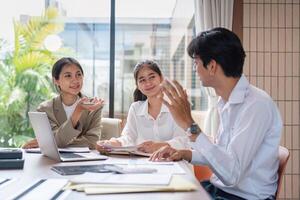 Business Team Collaborating on Work Plans During a Meeting in a Modern Office Setting photo