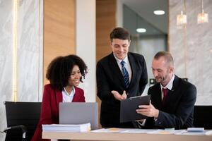 Diverse business team collaborating at office desk, Concept of teamwork photo