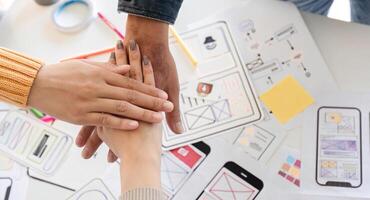Collaborative UXUI Designer Team Planning and Developing a Modern Digital System with Wireframes and Prototypes photo