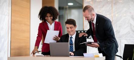 Diverse business team collaborating at office desk, Concept of teamwork photo