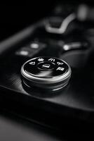Stylish driving mode control panel in car with intuitive icons for various driving conditions. Elegant design, high quality, and ease of use emphasize the premium feel of interior. Leasing, purchase photo