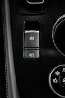 Stylish driving mode control panel in car with intuitive icons for various driving conditions. Elegant design, high quality, and ease of use emphasize the premium feel of interior. Leasing, purchase photo