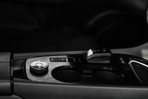 Stylish driving mode control panel in car with intuitive icons for various driving conditions. Elegant design, high quality, and ease of use emphasize the premium feel of interior. Leasing, purchase photo