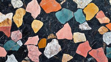 A mosaic made of colorful rocks and stones. The colors are bright and the stones are of various sizes. photo
