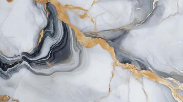A marble wall with gold and gray swirls. The gold and gray swirls are very prominent and the marble is very shiny. photo