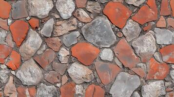 A brick wall with a variety of different colored bricks. The wall is made up of many different sized bricks, and the colors vary from red to gray. photo