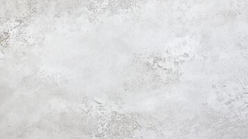 A white wall with a lot of spots and a few lines. The wall is very plain and has no decoration. photo