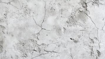 A wall with cracks and holes in it. The wall is white and has a rough texture. photo