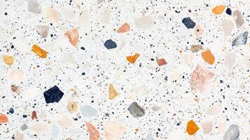 A mosaic tile floor with a variety of colored stones. The tiles are arranged in a pattern that creates a sense of depth and texture. photo