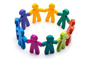 Colorful figurines holding hands in a circle on white background photo