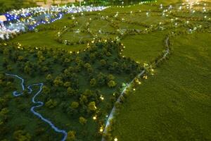 miniature of wide view of the land from above. In the center of the image, a winding river divides the landscape. photo