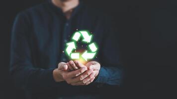 Man hand holding reduce reuse recycle symbol, Ecological and save the earth concept an ecological metaphor for ecological waste management and a sustainable development, Eco recycle technology concept photo