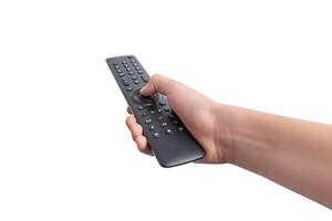 Hand holding a TV remote control featuring numbered channel buttons and additional function keys, isolated on a white background. Ideal for various backgrounds photo