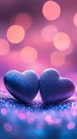 Two soft velvet hearts resting on a sparkling glitter surface, surrounded by glowing heart bokeh in the background, dreamy atmosphere with pink and purple tones photo