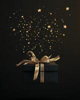 A black gift box with golden ribbon and stars floating mid-air, dark background with spacious empty space on top photo