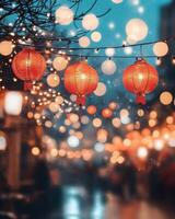 Hanging red lanterns glowing against a night sky, surrounded by bokeh lights and blurred figures celebrating a festival photo
