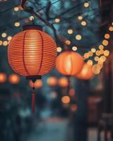 Rows of softly lit red lanterns hanging in a festive street, with warm blurry lights in the background, representing a cultural celebration photo