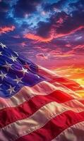 Waving American flag in vertical format, dramatic sunset sky in the background, vibrant stars and stripes photo