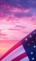 Close-up of American flag fabric in vertical frame, with a soft pink and purple sunset sky photo