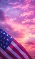 Close-up of American flag fabric in vertical frame, with a soft pink and purple sunset sky photo