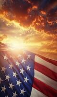 Vertical shot of the American flag, stars in focus with sunset-lit clouds in the background photo