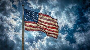 Zoomed-in American flag on a flagpole with dramatic sky in the background, vivid colors, texture of fabric visible photo