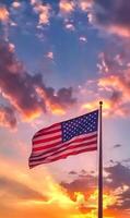 Zoomed-in vertical shot of the American flag with stars, background of a sunset sky photo