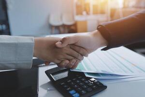 Business handshake for teamwork of business merger and acquisition,successful negotiate,hand shake,two businessman shake hand with partner to celebration partnership and business deal concept photo