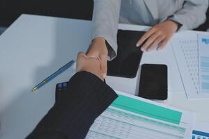 Business handshake for teamwork of business merger and acquisition,successful negotiate,hand shake,two businessman shake hand with partner to celebration partnership and business deal concept photo