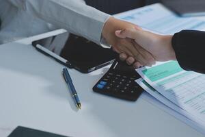 Business handshake for teamwork of business merger and acquisition,successful negotiate,hand shake,two businessman shake hand with partner to celebration partnership and business deal concept photo