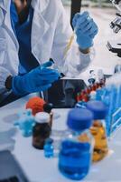 Scientist using microscope in laboratory. Close-up of a researcher's hands adjusting a modern microscope in a lab setting. Science concept photo