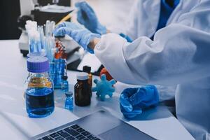 Scientist using microscope in laboratory. Close-up of a researcher's hands adjusting a modern microscope in a lab setting. Science concept photo