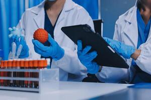 Scientist using microscope in laboratory. Close-up of a researcher's hands adjusting a modern microscope in a lab setting. Science concept photo