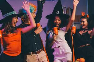 Joyful office Halloween party with coworkers in costumes, celebrating with drinks and laughter, fostering teamwork and festive spirit photo