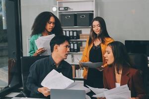 Stress, business people and employee frustrated with multitasking, pressure or overworked by team in chaos with paperwork. Anxiety, headache and worker overwhelmed by group and burnout in crisis photo