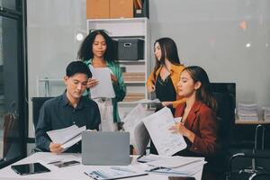 Stress, business people and employee frustrated with multitasking, pressure or overworked by team in chaos with paperwork. Anxiety, headache and worker overwhelmed by group and burnout in crisis photo
