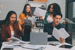 Stress, business people and employee frustrated with multitasking, pressure or overworked by team in chaos with paperwork. Anxiety, headache and worker overwhelmed by group and burnout in crisis photo