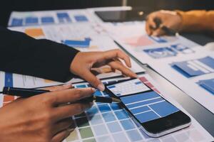 The designer team is designing the uxui system to make the uxui system work well on new phones and support system updates. Website development concept UI UX front end designer photo