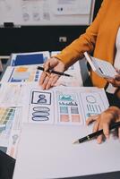 The designer team is designing the uxui system to make the uxui system work well on new phones and support system updates. Website development concept UI UX front end designer photo