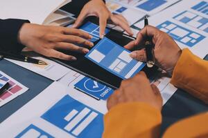 The designer team is designing the uxui system to make the uxui system work well on new phones and support system updates. Website development concept UI UX front end designer photo