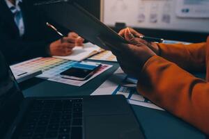 The designer team is designing the uxui system to make the uxui system work well on new phones and support system updates. Website development concept UI UX front end designer photo