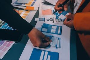 The designer team is designing the uxui system to make the uxui system work well on new phones and support system updates. Website development concept UI UX front end designer photo