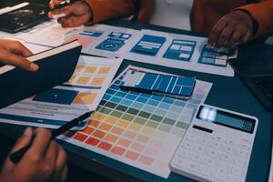 The designer team is designing the uxui system to make the uxui system work well on new phones and support system updates. Website development concept UI UX front end designer photo