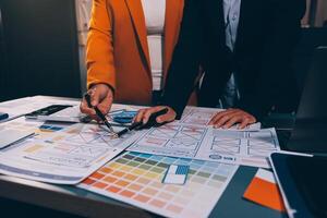 The designer team is designing the uxui system to make the uxui system work well on new phones and support system updates. Website development concept UI UX front end designer photo