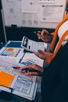 The designer team is designing the uxui system to make the uxui system work well on new phones and support system updates. Website development concept UI UX front end designer photo