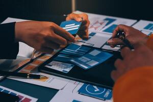 The designer team is designing the uxui system to make the uxui system work well on new phones and support system updates. Website development concept UI UX front end designer photo
