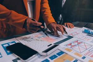 The designer team is designing the uxui system to make the uxui system work well on new phones and support system updates. Website development concept UI UX front end designer photo
