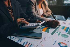 Team of business people are meeting to analyze data for marketing plan,Market research reports and income statistics, Financial and Accounting concept. photo